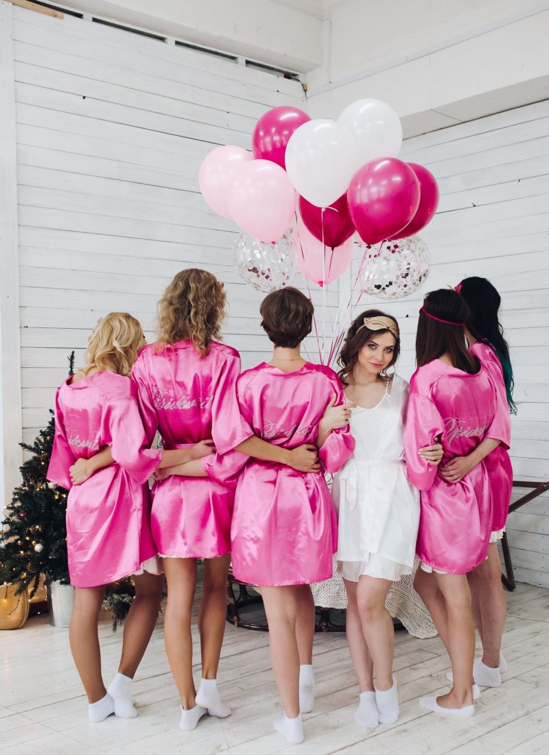 full-length-of-bride-in-white-robe-with-bridesmaid-2021-09-03-06-34-52-utc (1)